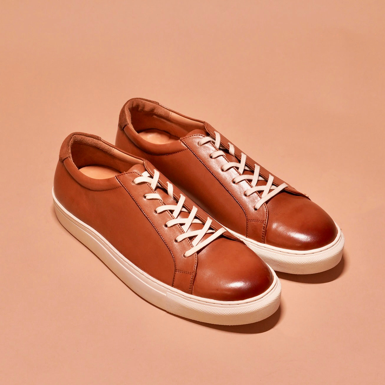 Bosco tan leather sneakers by dmodot with two-tone finish and brown suede detail.