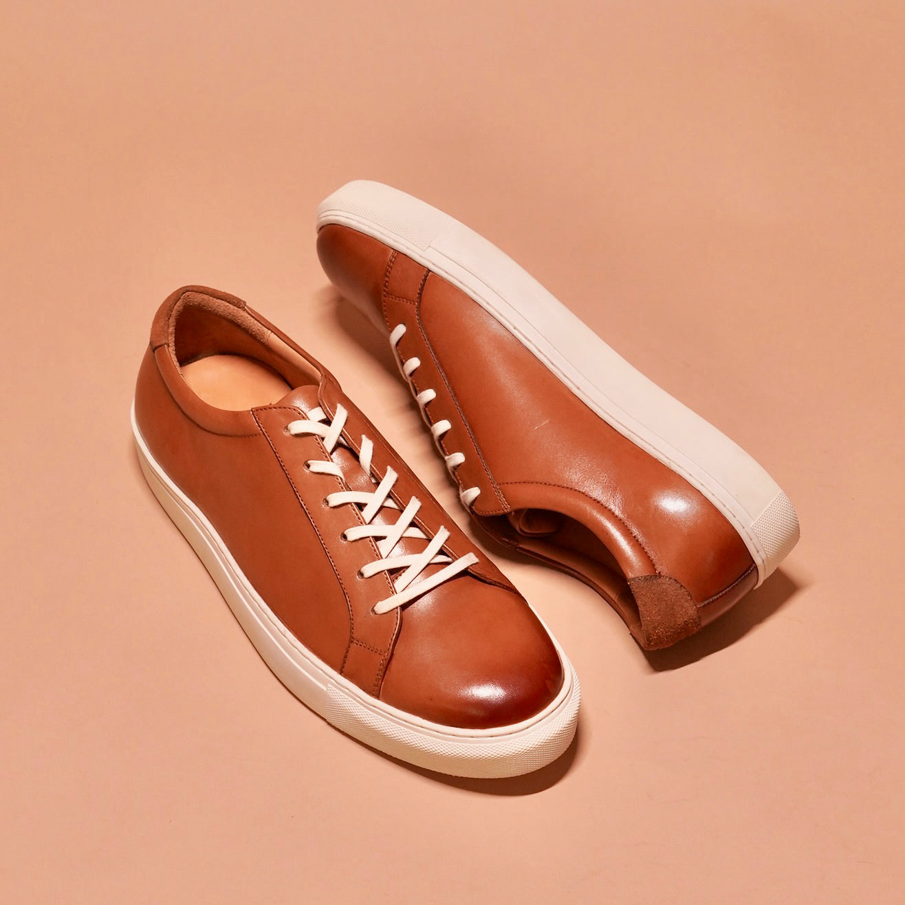 Close-up of Bosco tan leather sneakers' padded insole and superior cushioning.